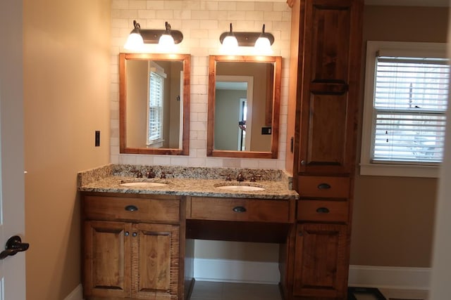 bathroom with vanity and backsplash