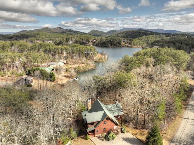 drone / aerial view featuring a water and mountain view