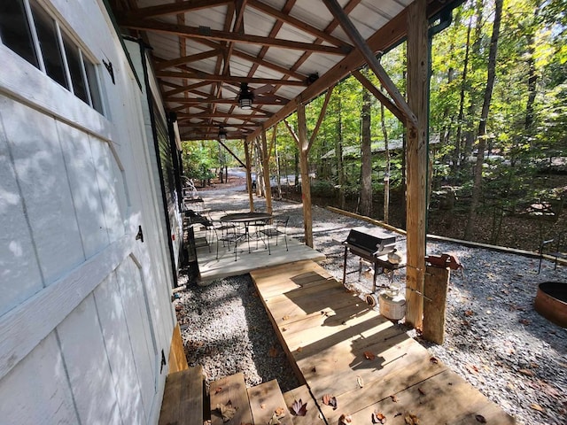 view of patio featuring ceiling fan and a deck