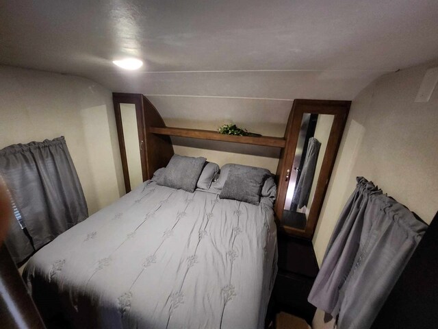 bedroom featuring lofted ceiling