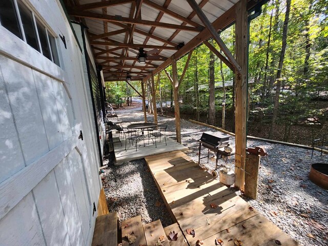 view of patio / terrace with ceiling fan and a deck