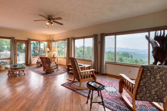 645 E Double Knob Dr, Hayesville, NC 28904 - sunroom / solarium featuring a textured ceiling, wood-type flooring, and baseboards