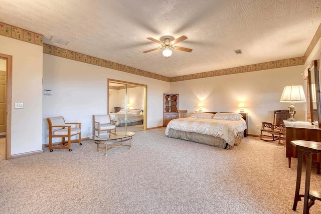 645 E Double Knob Dr, Hayesville, NC 28904 - carpeted bedroom featuring baseboards, a textured ceiling, a closet, and a ceiling fan