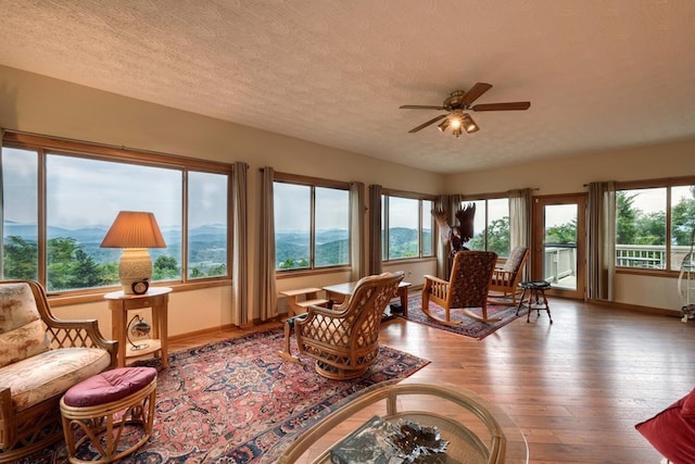 645 E Double Knob Dr, Hayesville, NC 28904 - sunroom with baseboards, hardwood / wood-style flooring, and a textured ceiling