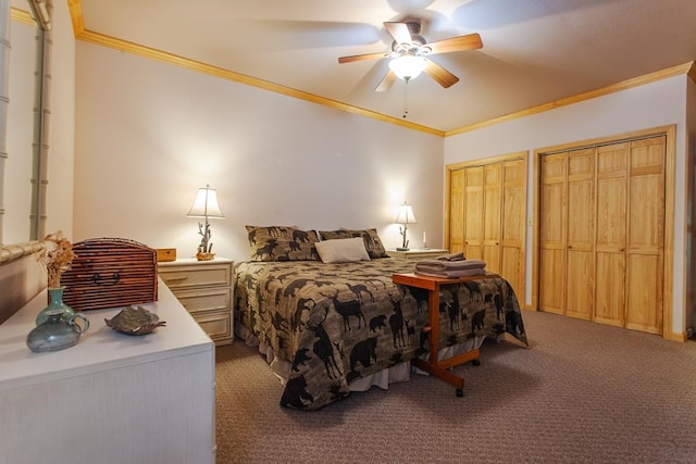 bedroom featuring carpet flooring, two closets, ceiling fan, and crown molding