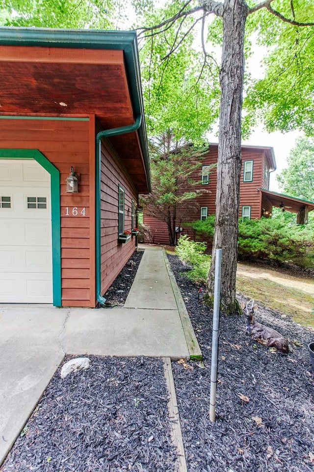 view of side of property featuring a garage