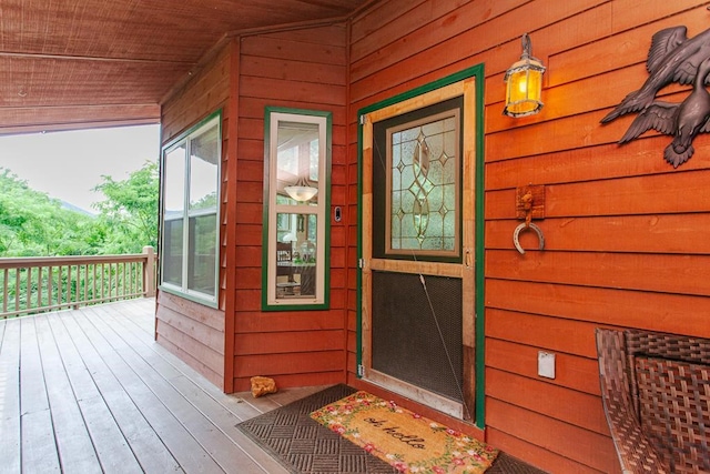 doorway to property featuring a porch