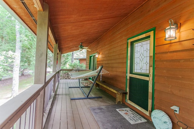 wooden deck featuring ceiling fan and a porch