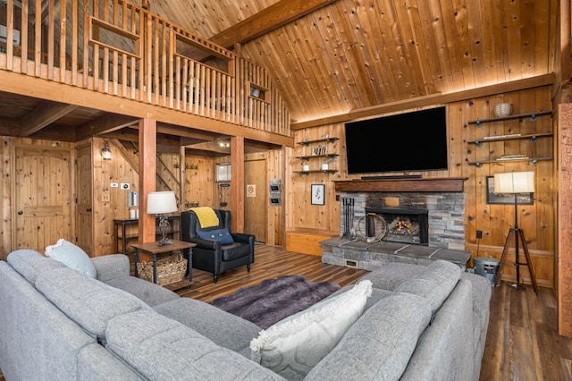 living room with beam ceiling, wooden walls, wooden ceiling, and hardwood / wood-style flooring