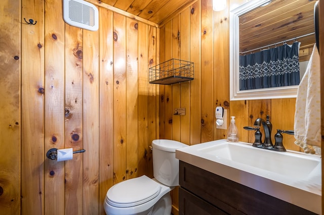 bathroom featuring vanity, toilet, wood ceiling, and wood walls