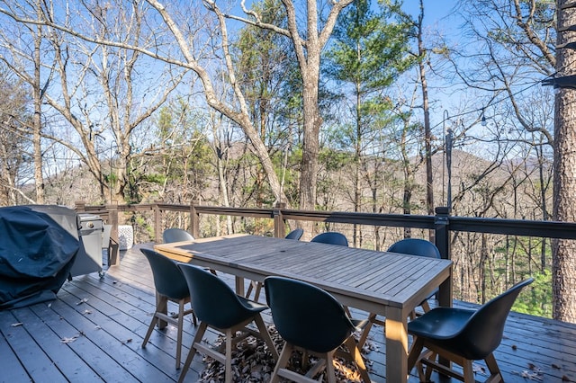 wooden terrace with area for grilling