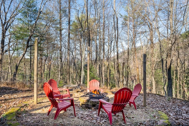 view of yard with a fire pit