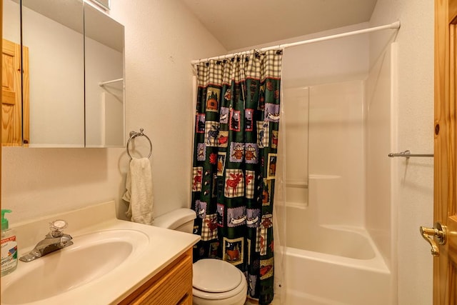 bathroom with shower / bathtub combination with curtain, vanity, and toilet