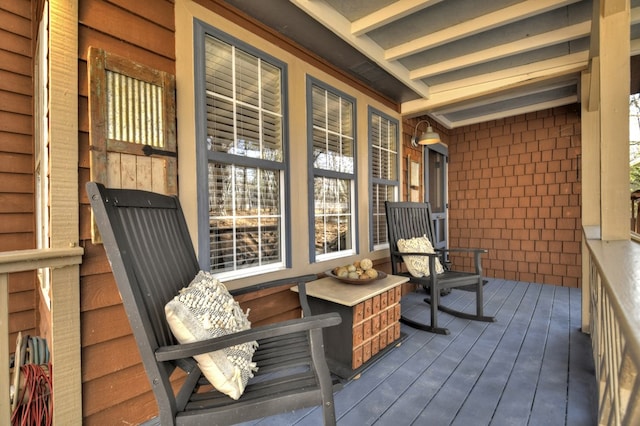 wooden terrace featuring a porch