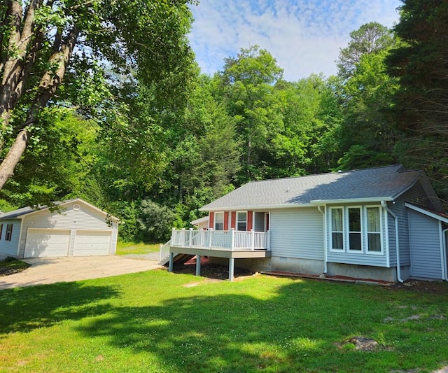 view of front of home with a porch, a garage, an outdoor structure, and a front lawn