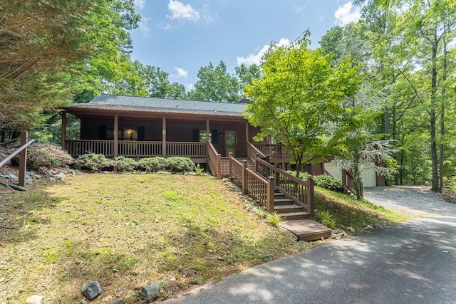 view of front of home with a front lawn and a porch