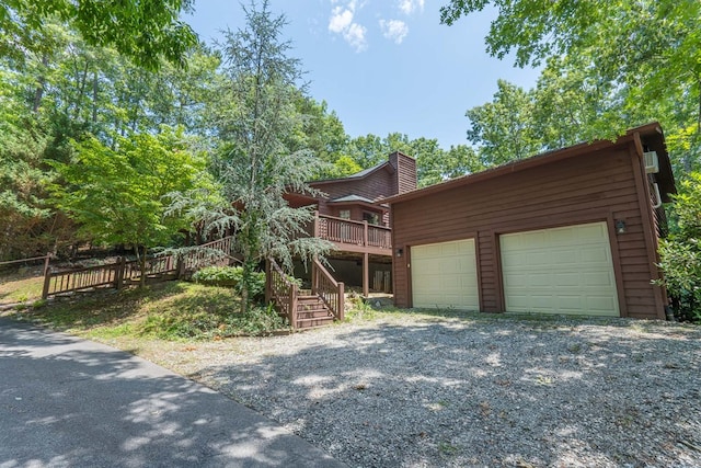 view of front facade featuring a garage and a deck