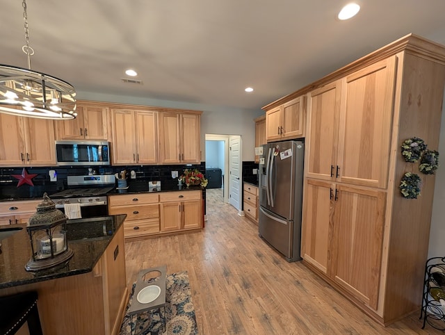 181 Charles Ln, Morganton, GA 30560 - kitchen featuring appliances with stainless steel finishes, a chandelier, light brown cabinets, tasteful backsplash, and recessed lighting