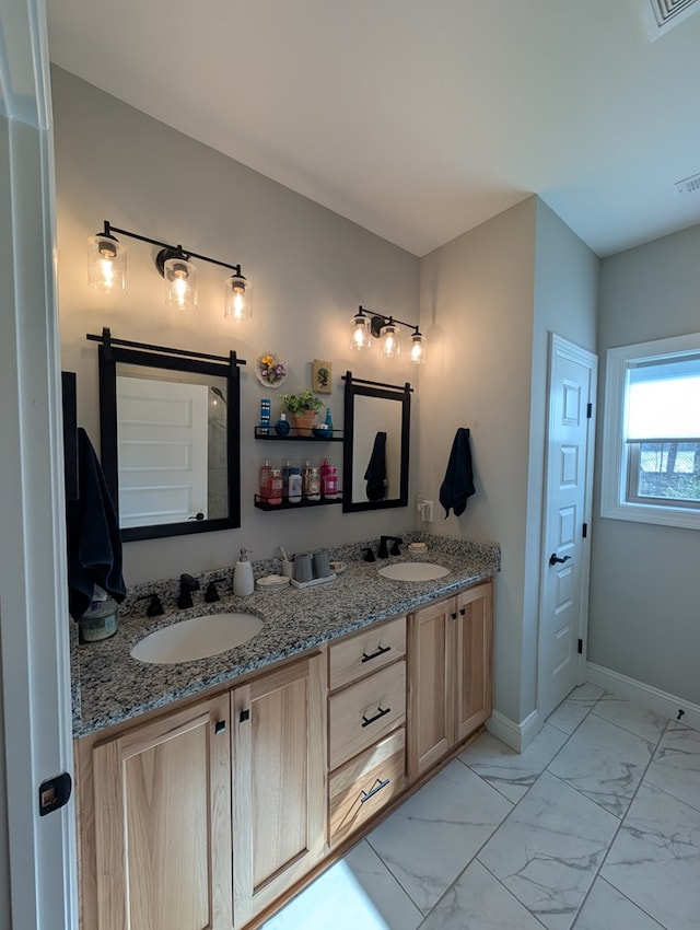 181 Charles Ln, Morganton, GA 30560 - full bathroom featuring double vanity, marble look tiles, and baseboards