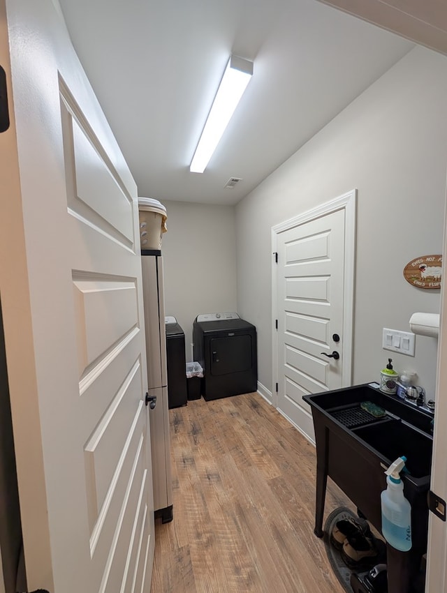 181 Charles Ln, Morganton, GA 30560 - home office with light wood-style floors and separate washer and dryer