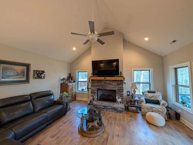 181 Charles Ln, Morganton, GA 30560 - living area with ceiling fan, high vaulted ceiling, plenty of natural light, wood finished floors, and a stone fireplace