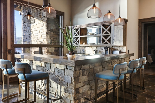 bar featuring decorative light fixtures