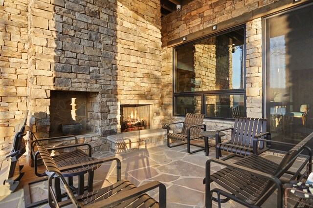 view of patio / terrace with a stone fireplace