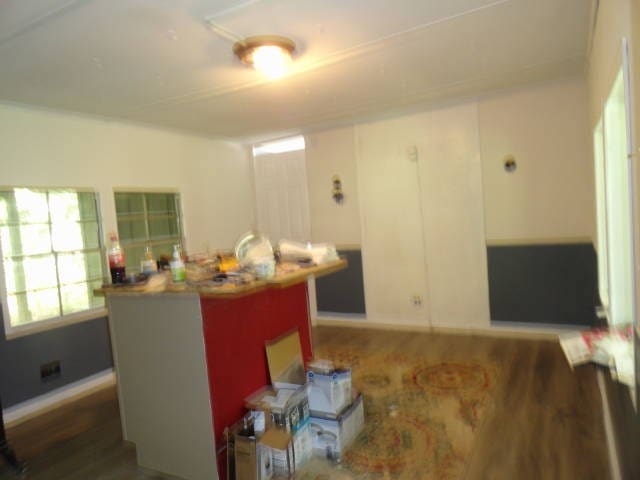 kitchen with white cabinets and dark wood-type flooring