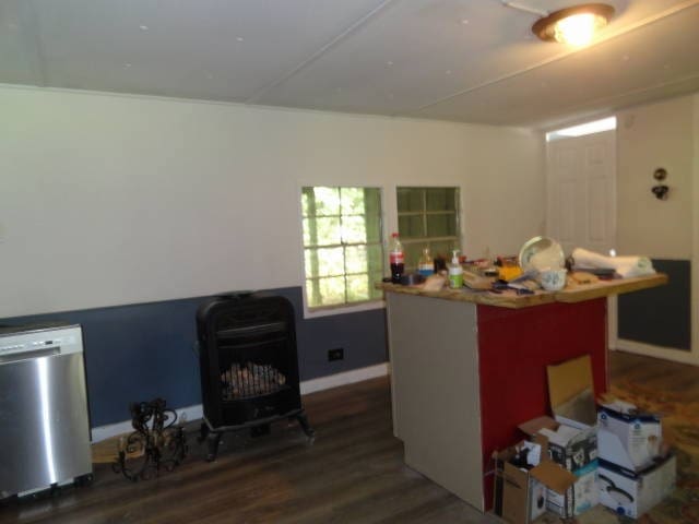 kitchen featuring dishwasher and dark hardwood / wood-style floors