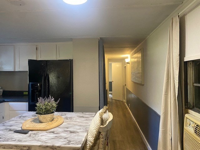 dining area with dark wood-type flooring