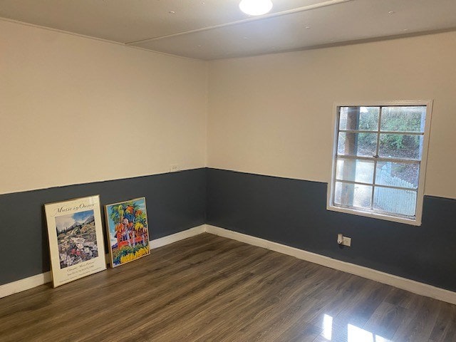 empty room with dark hardwood / wood-style floors