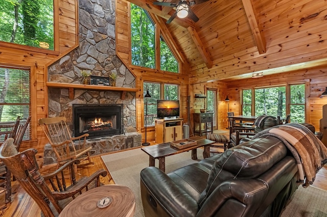 77 Old Covered Bridge Rd, Cherry Log, GA 30522 - living room featuring plenty of natural light, wood finished floors, high vaulted ceiling, wooden walls, and ceiling fan