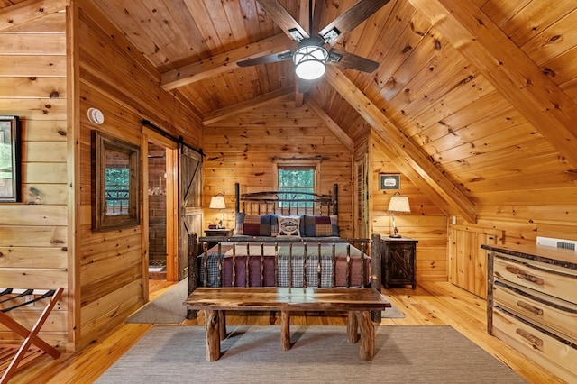 77 Old Covered Bridge Rd, Cherry Log, GA 30522 - bedroom featuring wood walls, light wood-type flooring, a barn door, and wooden ceiling