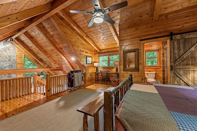 77 Old Covered Bridge Rd, Cherry Log, GA 30522 - dining space with wooden ceiling, a barn door, wood walls, a ceiling fan, and wood finished floors
