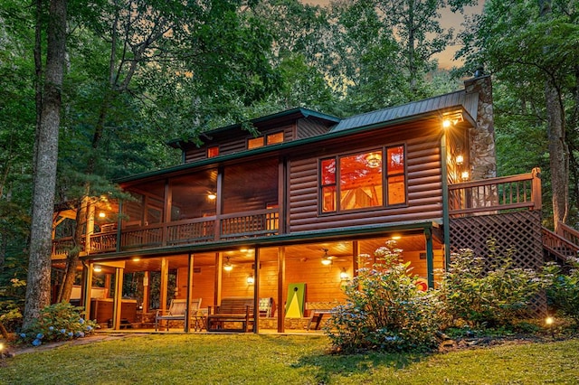 77 Old Covered Bridge Rd, Cherry Log, GA 30522 - back of property featuring faux log siding, a lawn, a chimney, a metal roof, and a patio