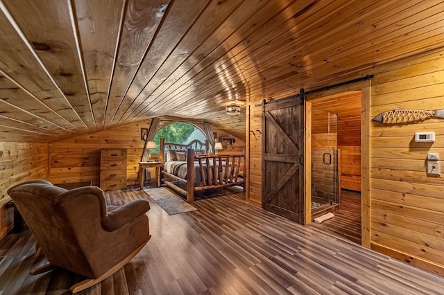 77 Old Covered Bridge Rd, Cherry Log, GA 30522 - living area with wood walls, lofted ceiling, wood ceiling, wood finished floors, and a barn door