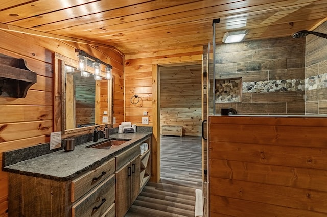 77 Old Covered Bridge Rd, Cherry Log, GA 30522 - full bath with wood finished floors, wooden walls, vanity, wood ceiling, and a tile shower