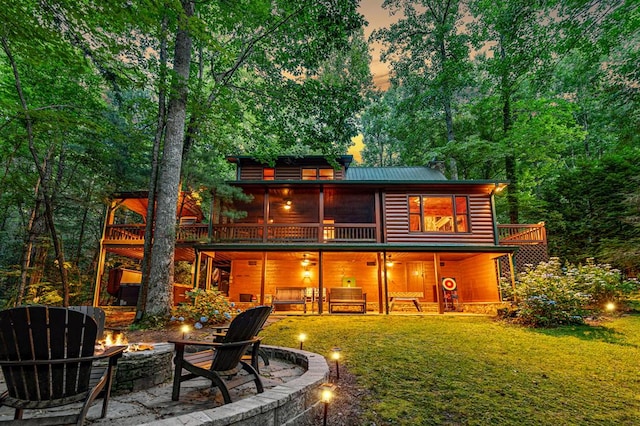 77 Old Covered Bridge Rd, Cherry Log, GA 30522 - back of house featuring a fire pit, log veneer siding, a yard, a patio, and a wooden deck