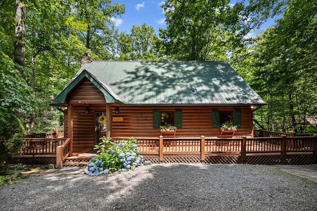 77 Old Covered Bridge Rd, Cherry Log, GA 30522 - view of front facade featuring a deck, a chimney, a metal roof, and log veneer siding