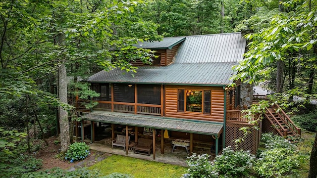 77 Old Covered Bridge Rd, Cherry Log, GA 30522 - rear view of house featuring a patio, stairway, a sunroom, a chimney, and a metal roof