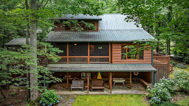 77 Old Covered Bridge Rd, Cherry Log, GA 30522 - rear view of property with a patio, a metal roof, log veneer siding, and a sunroom