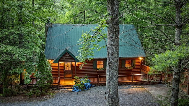 77 Old Covered Bridge Rd, Cherry Log, GA 30522 - back of property with log veneer siding, a deck, a metal roof, and a wooded view