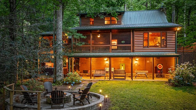 77 Old Covered Bridge Rd, Cherry Log, GA 30522 - back of house with a fire pit, a patio, log veneer siding, and a lawn
