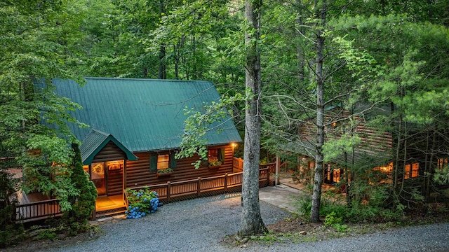 77 Old Covered Bridge Rd, Cherry Log, GA 30522 - view of front of property featuring log veneer siding, driveway, a metal roof, and a wooded view