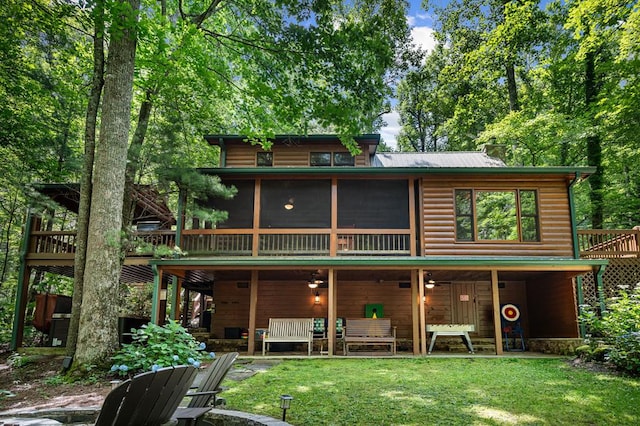 77 Old Covered Bridge Rd, Cherry Log, GA 30522 - back of house featuring ceiling fan, log veneer siding, a sunroom, and a lawn