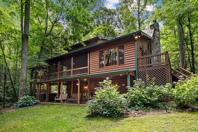 77 Old Covered Bridge Rd, Cherry Log, GA 30522 - rear view of property featuring faux log siding, a chimney, a sunroom, a yard, and stairs