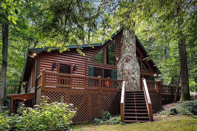 77 Old Covered Bridge Rd, Cherry Log, GA 30522 - back of property with stairway, faux log siding, a wooden deck, and a chimney