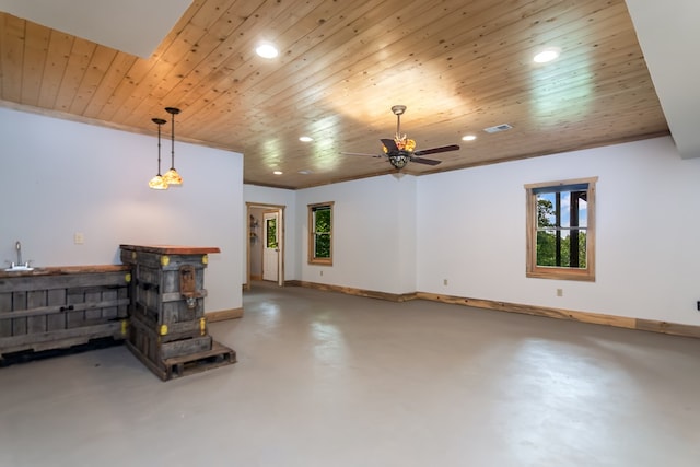 living area with wooden ceiling, recessed lighting, baseboards, indoor wet bar, and finished concrete floors