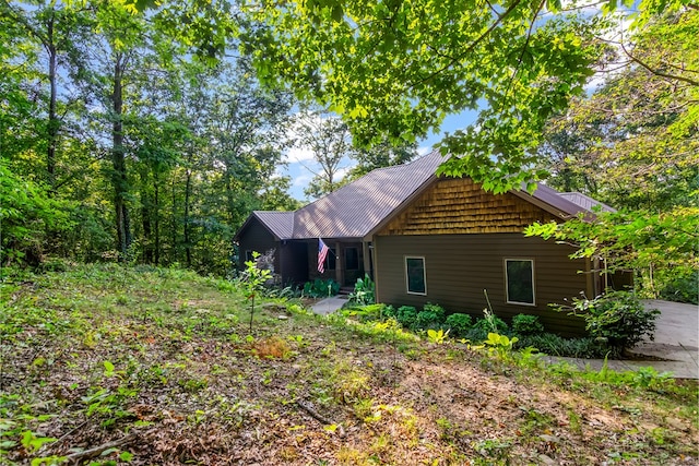 view of side of property featuring metal roof