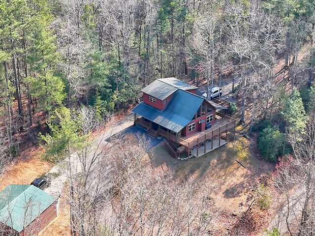 aerial view featuring a view of trees